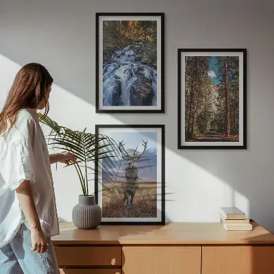 Three-piece wall art set featuring a waterfall in a mountain forest with deer and nature scenery