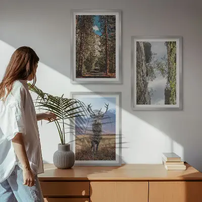 Set of 3 framed wall art pieces featuring a road through a forest with mountains and a deer