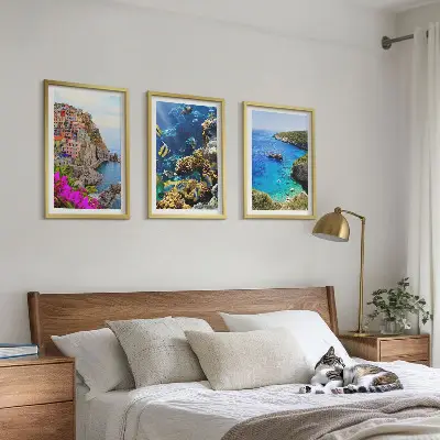 Set of 3 framed wall art pieces seaside views with colorful houses