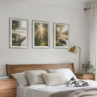 Set of 3 framed wall art pieces featuring a lake, forest, boat, and morning fog