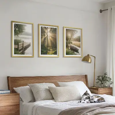 Set of 3 framed wall art pieces featuring a lake, forest, boat, and morning fog