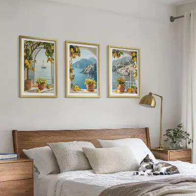 Set of 3 framed wall art pieces featuring sea town with lemons and flowers
