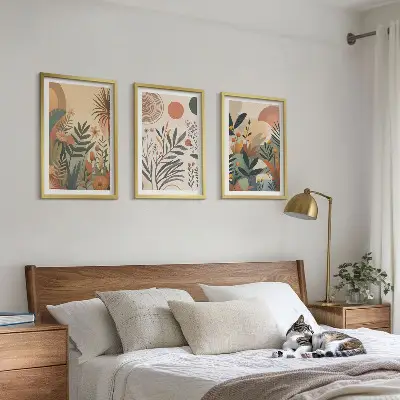 Three-piece wall art set with plant motifs in subdued colors