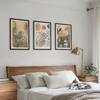 Three-piece wall art set with plant motifs in subdued colors