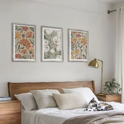 Three-piece wall art set with floral patterns in orange and green
