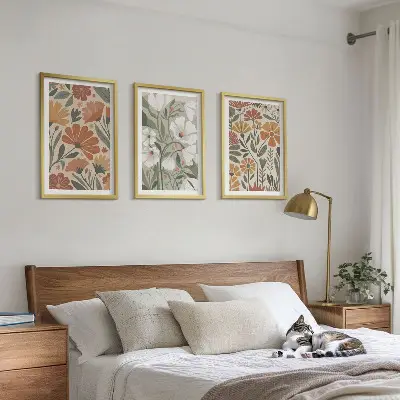 Three-piece wall art set with floral patterns in orange and green