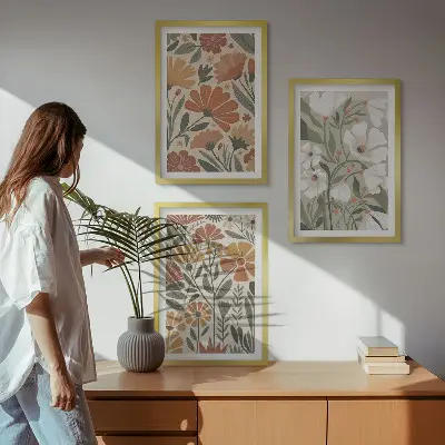 Three-piece wall art set with floral patterns in orange and green