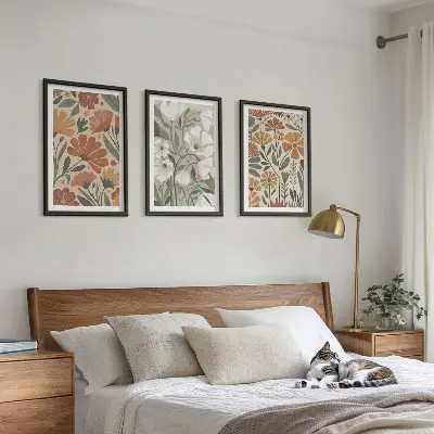 Three-piece wall art set with floral patterns in orange and green