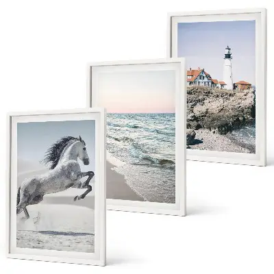 Wall art set featuring horses on a beach with a lighthouse and waves