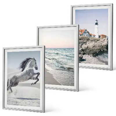 Wall art set featuring horses on a beach with a lighthouse and waves