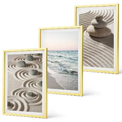 Set of 3 framed wall art pieces featuring waves, sand, water, and beach stones