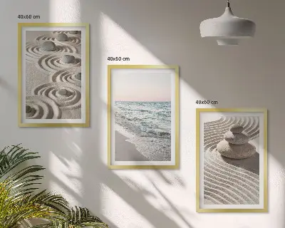 Set of 3 framed wall art pieces featuring waves, sand, water, and beach stones