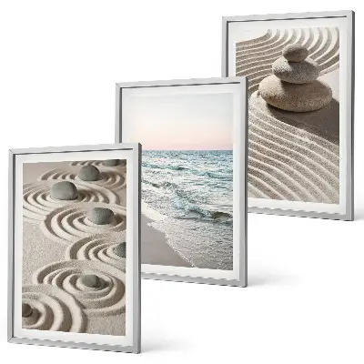 Set of 3 framed wall art pieces featuring waves, sand, water, and beach stones