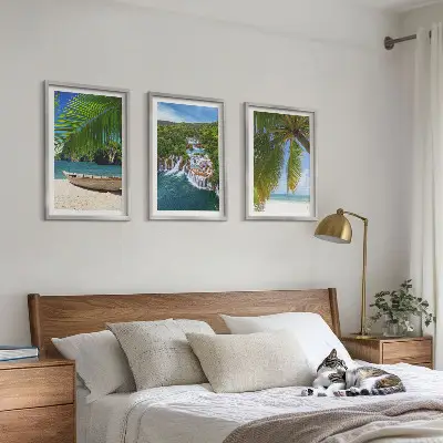 Three-piece wall art set featuring a beach, boat, waterfalls, and palm trees