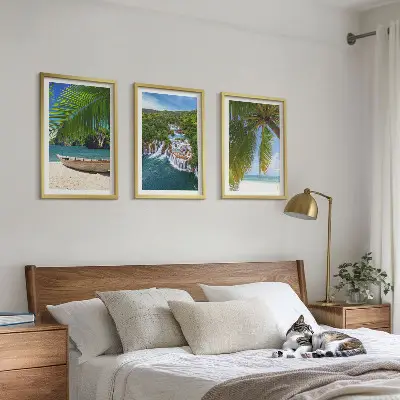 Three-piece wall art set featuring a beach, boat, waterfalls, and palm trees