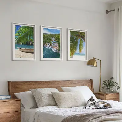 Three-piece wall art set featuring a beach, boat, waterfalls, and palm trees