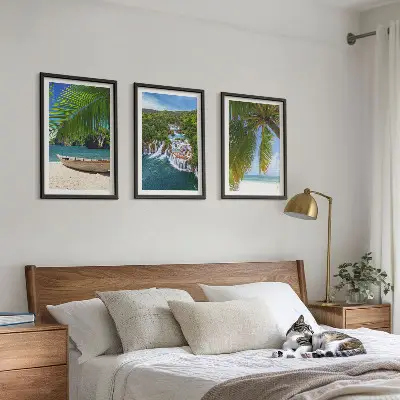 Three-piece wall art set featuring a beach, boat, waterfalls, and palm trees