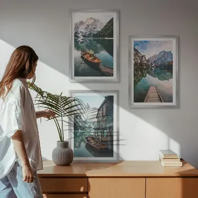 Set of 3 framed wall art pieces featuring a lake, mountains, boat, and cottage