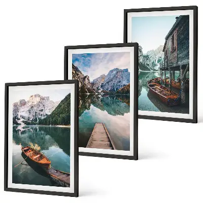 Set of 3 framed wall art pieces featuring a lake, mountains, boat, and cottage