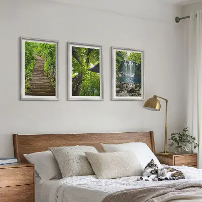 Set of 3 framed wall art pieces featuring a path through a forest with a waterfall and lush vegetation