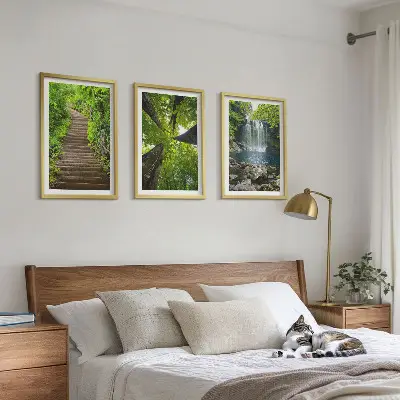 Set of 3 framed wall art pieces featuring a path through a forest with a waterfall and lush vegetation