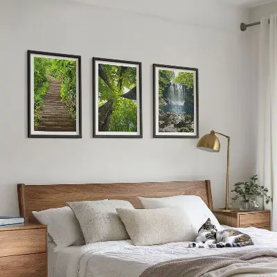 Set of 3 framed wall art pieces featuring a path through a forest with a waterfall and lush vegetation