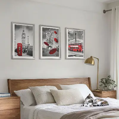 Set of 3 framed wall art pieces featuring a red umbrella booth and a London bus