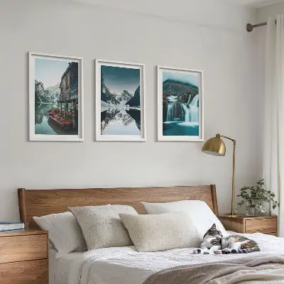 Set of 3 framed wall art pieces featuring mountain landscapes with waterfalls and lakes
