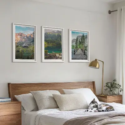 Three-piece mountain landscape wall art featuring a lake and bridge