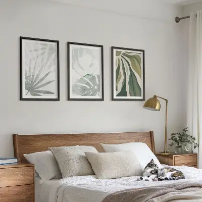 Wall art set featuring green and gray plant leaves