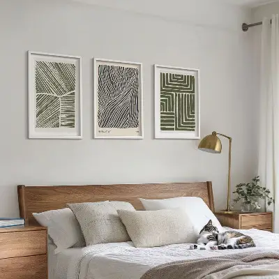 Set of 3 framed wall art pieces with green patterned lines and shapes