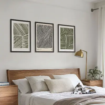 Set of 3 framed wall art pieces with green patterned lines and shapes