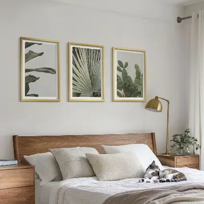 Three-piece wall art set pastel tropical leaves design