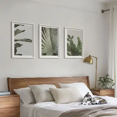 Three-piece wall art set pastel tropical leaves design