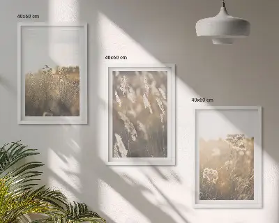 Set of 3 framed landscape wall art prints featuring grass and warm flowers