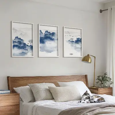 Set of 3 framed wall art pieces featuring mountains, clouds, trees, and birds