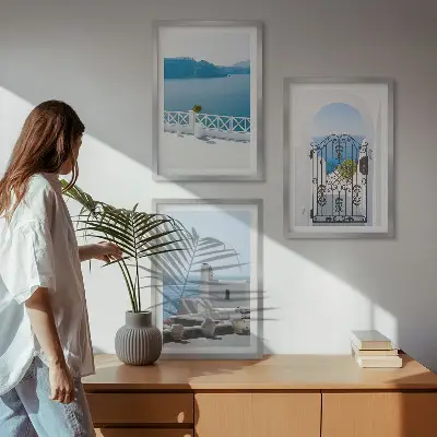 Set of 3 framed wall art pieces featuring white buildings by the sea in Greece