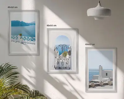 Set of 3 framed wall art pieces featuring white buildings by the sea in Greece