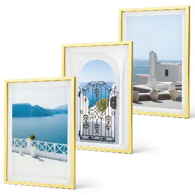 Set of 3 framed wall art pieces featuring white buildings by the sea in Greece