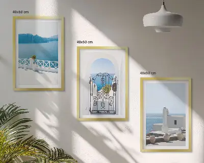 Set of 3 framed wall art pieces featuring white buildings by the sea in Greece