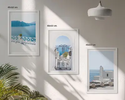 Set of 3 framed wall art pieces featuring white buildings by the sea in Greece