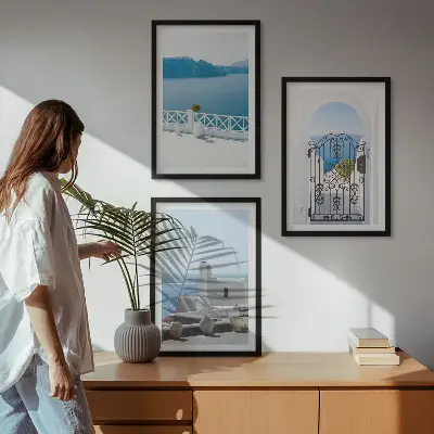 Set of 3 framed wall art pieces featuring white buildings by the sea in Greece