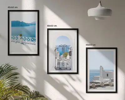 Set of 3 framed wall art pieces featuring white buildings by the sea in Greece