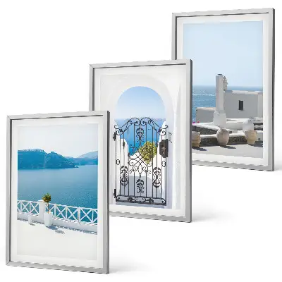 Set of 3 framed wall art pieces featuring white buildings by the sea in Greece