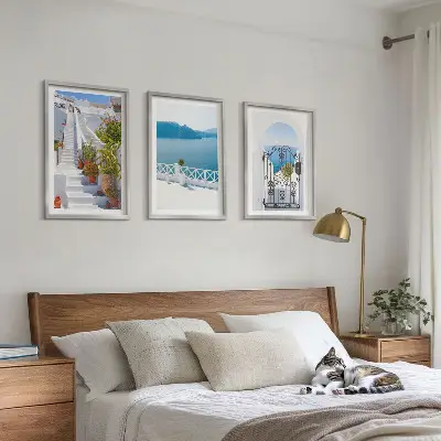 Three-piece wall art set featuring white stairs with plants and a sea gate