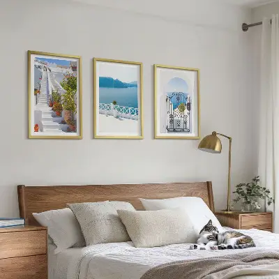 Three-piece wall art set featuring white stairs with plants and a sea gate