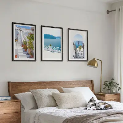Three-piece wall art set featuring white stairs with plants and a sea gate