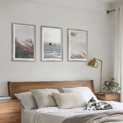 Three-piece wall art set featuring mountains, clouds, sea, and sand nature scenery