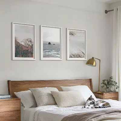 Three-piece wall art set featuring mountains, clouds, sea, and sand nature scenery