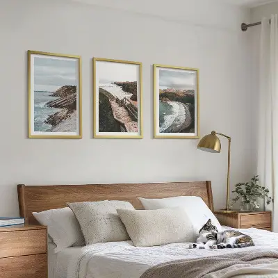 Set of 3 framed wall art pieces featuring cliff views and beach landscapes